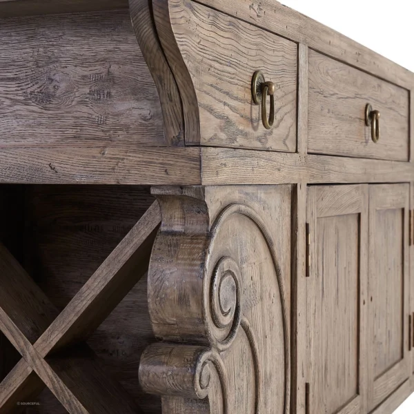 A close up of the drawers and doors on an old wooden cabinet.