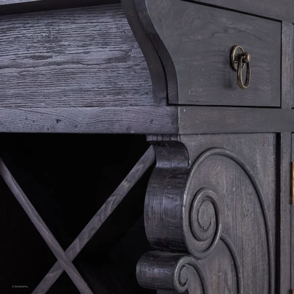 A close up of the drawer and door on an old dresser.