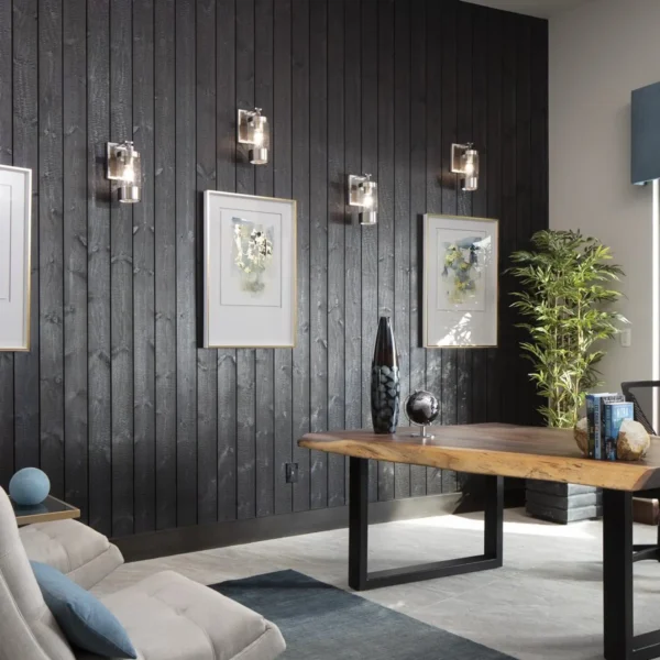 A living room with black walls and white furniture.