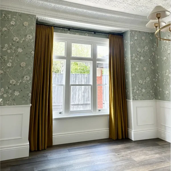 A room with two windows and a wooden floor