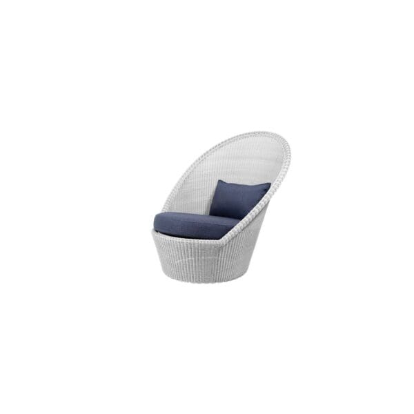 A white chair with blue cushion on top of it.