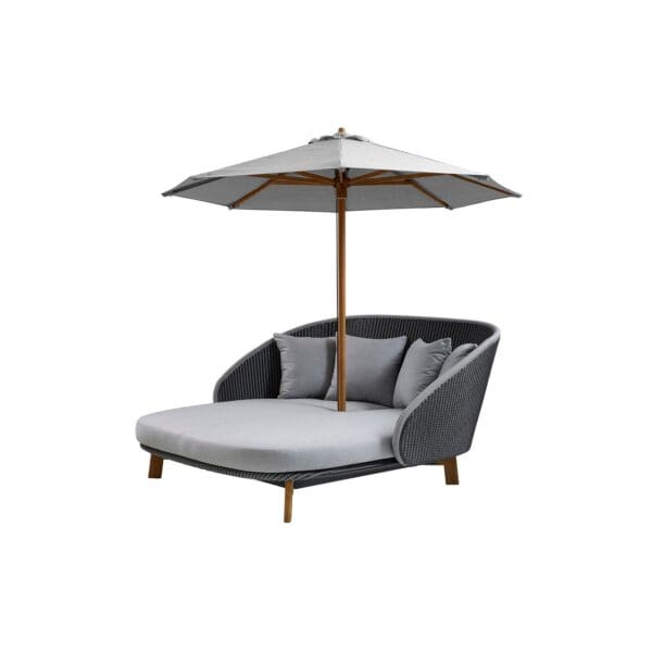 A gray outdoor furniture with an umbrella