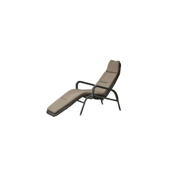 A lounge chair with a foot rest on top of it.