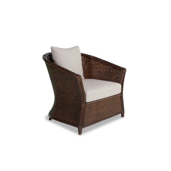 A brown chair with white cushions on top of it.