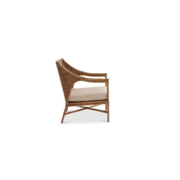 A wooden chair with beige cushion on top of it.