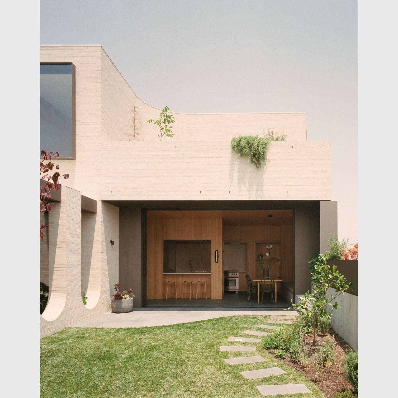 A house with a garden and patio area.