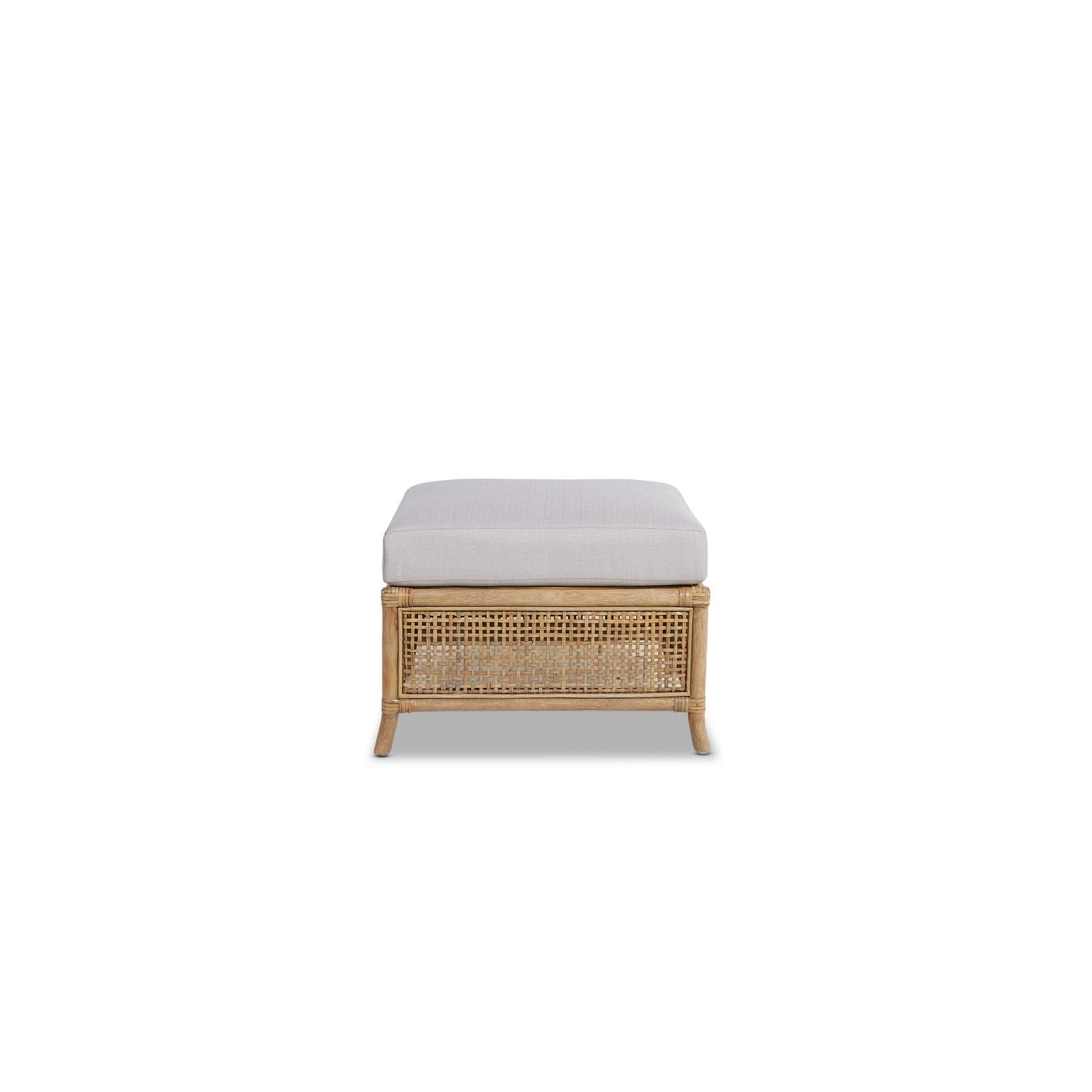 A white ottoman with a wooden frame and cushion.