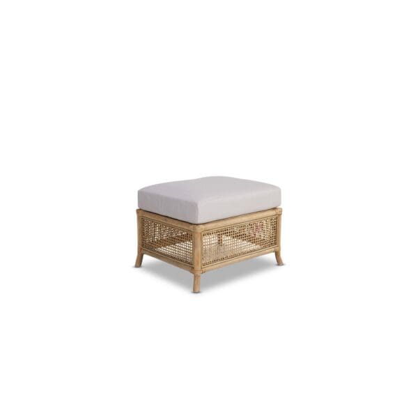 A white ottoman with a wooden frame and cushion.