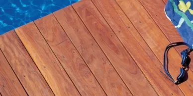 A close up of the wood floor and pool