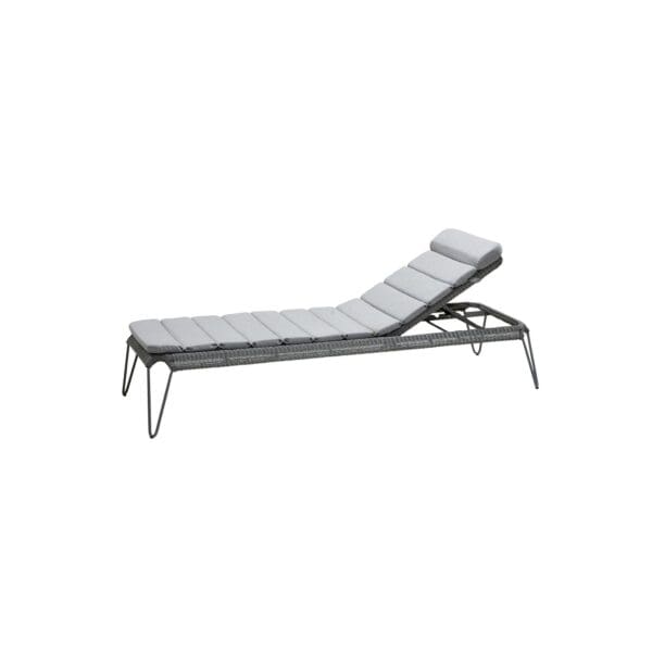 A white lounge chair with a gray cushion.